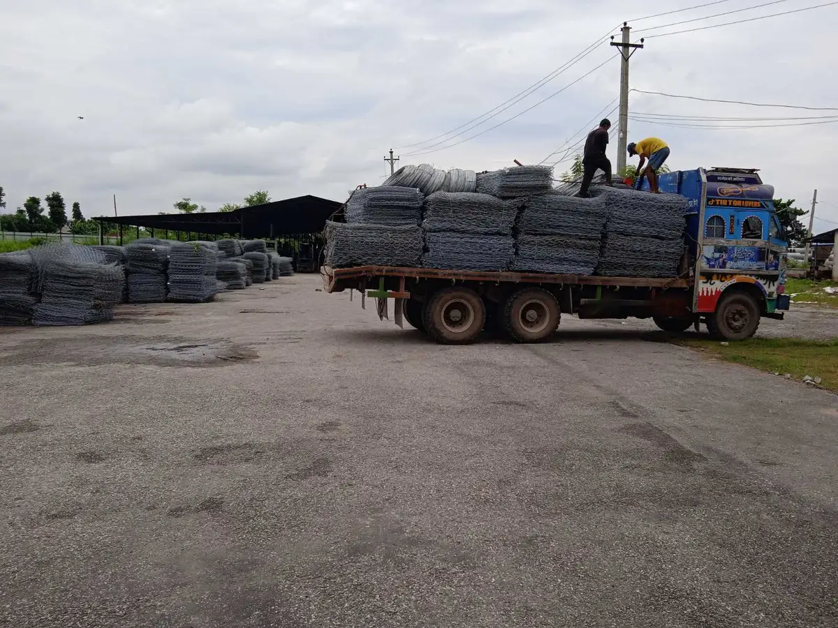 Hexagonal double-twisted gabion mesh rolls being loaded for dispatch at United Wire & Steel Industries, Ratnanagar